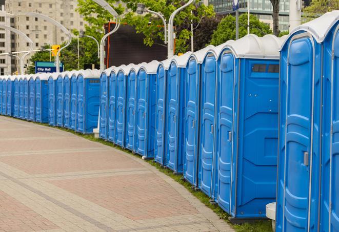 a row of portable restrooms set up for a large athletic event, allowing participants and spectators to easily take care of their needs in Middlefield, OH